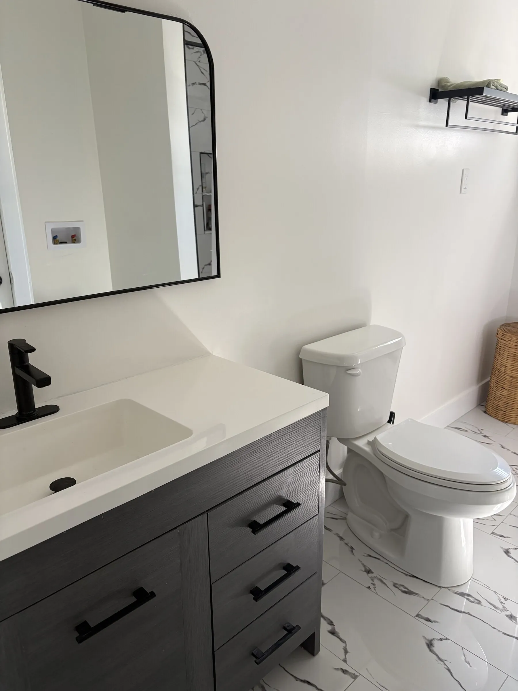 Bathroom vanity with black hardware