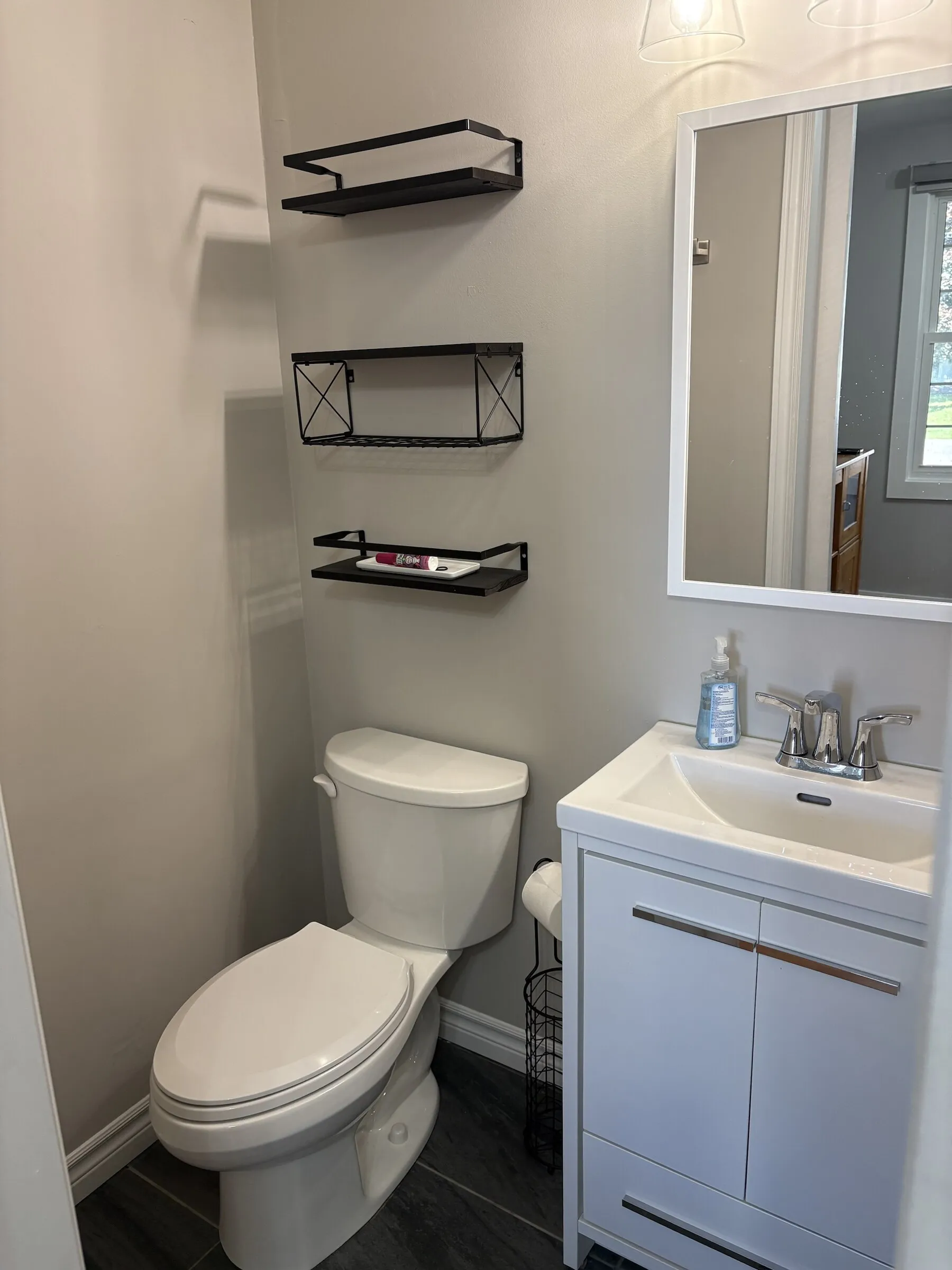 Second bathroom with floating shelves